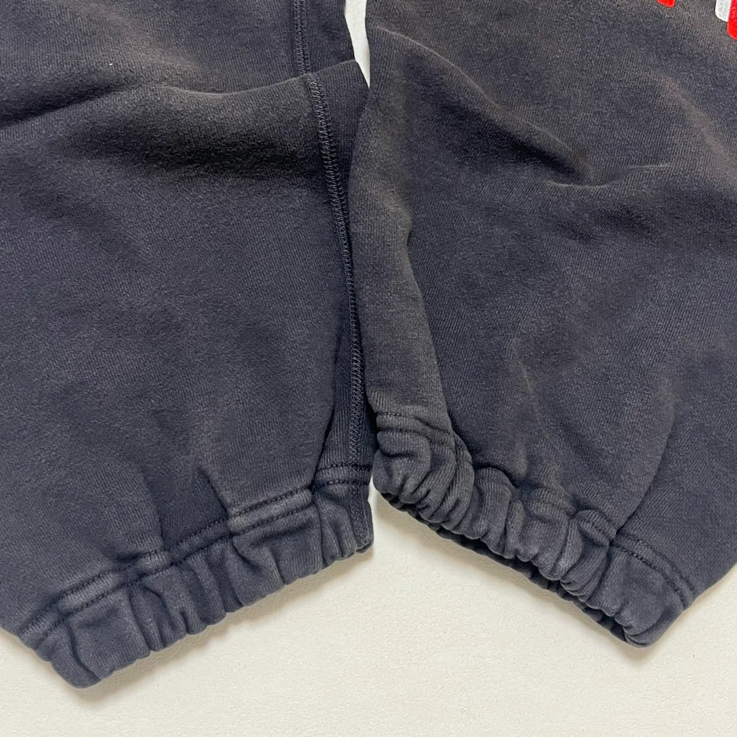 SAINT Mxxxxxx x DENIM TEARS STRUGGLE SWTPNTS/BLK DT co-branded boxing retro distressed sweatpants, washed black S-XL Assute dyeing, whole piece sprayed with horse fade, authentic grade crack printing, mold customization co-branded main mark/washed mark, factory four-needle six-thread workmanship, no bone seams, more comfortable to wear